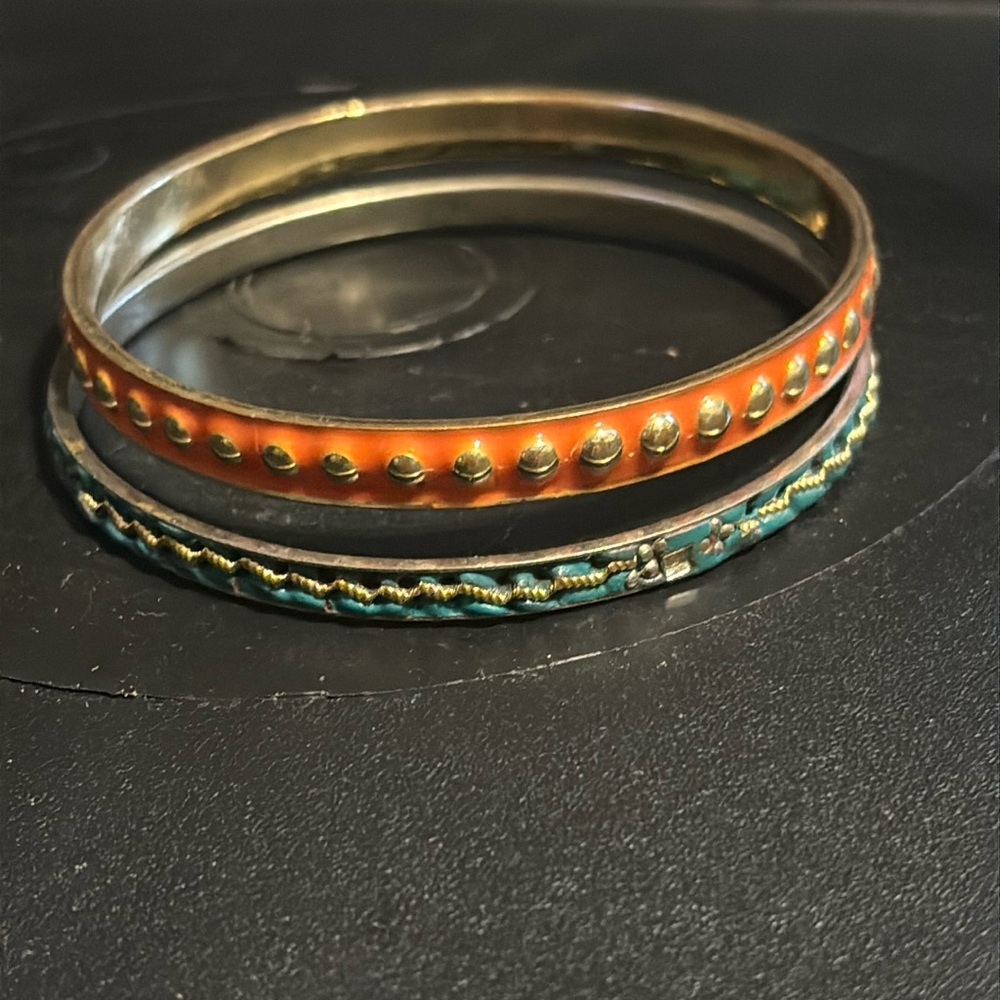 Two layering bracelets one orange and one blue